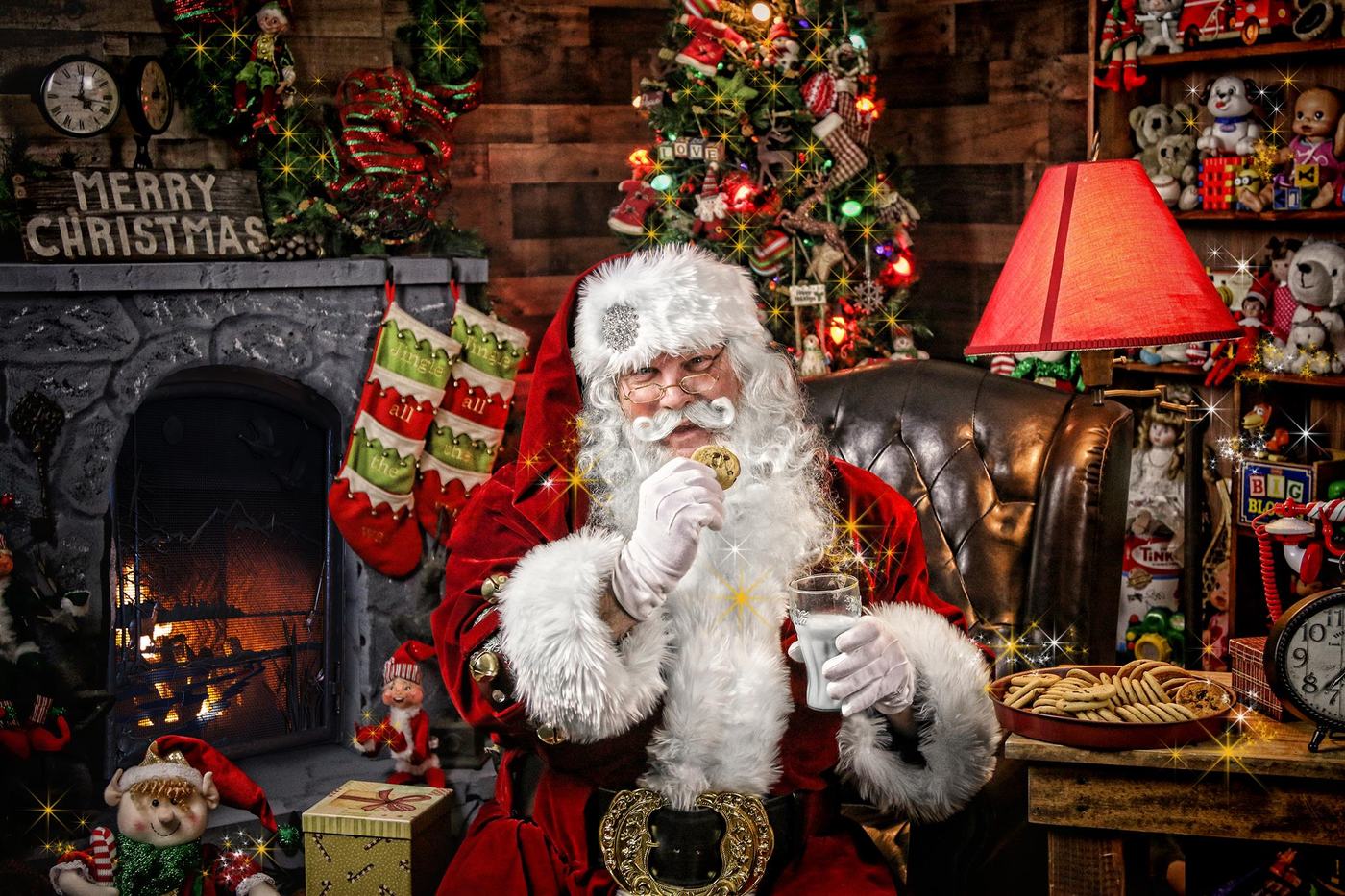 Santa Doug enjoying a cookie and a glass of milk by the fire